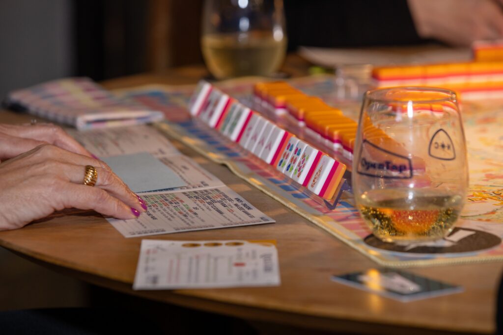 pexels photo 30649590 30649590 Engaging game night scene with friends playing mahjong and enjoying drinks. Perfect social moment.